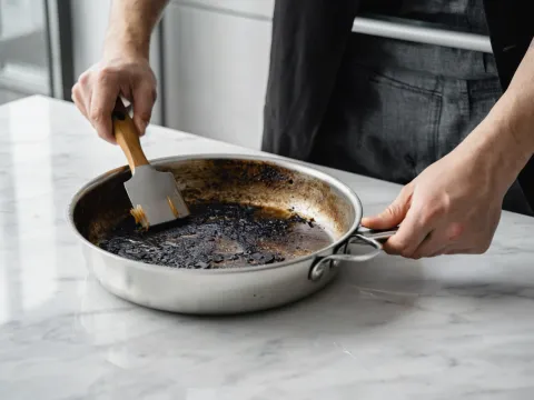 How to Naturally Clean a Burnt Pan with Baking Soda & Vinegar